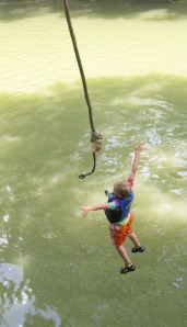 The plunge! A rope swing offers diversion on the Coosawattee River.